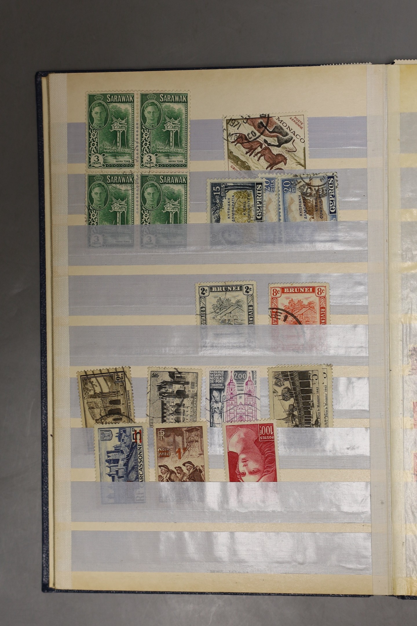 Two small stock books British Commonwealth, France mint stamps and packets